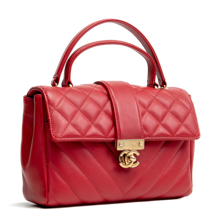 Bolsa de colgajo de mango superior de Chanel en la ciudad - rojo