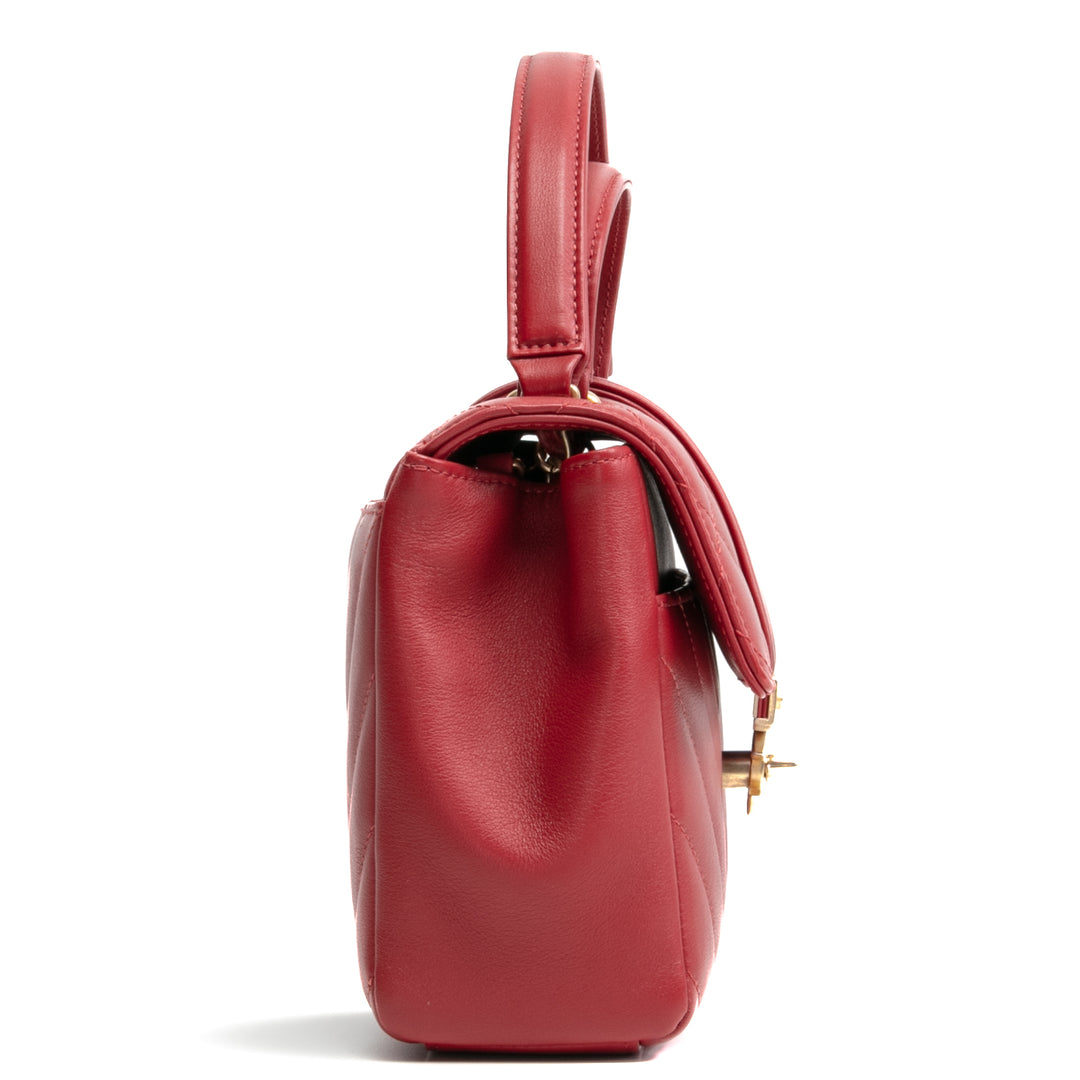 Bolsa de colgajo de mango superior de Chanel en la ciudad - rojo