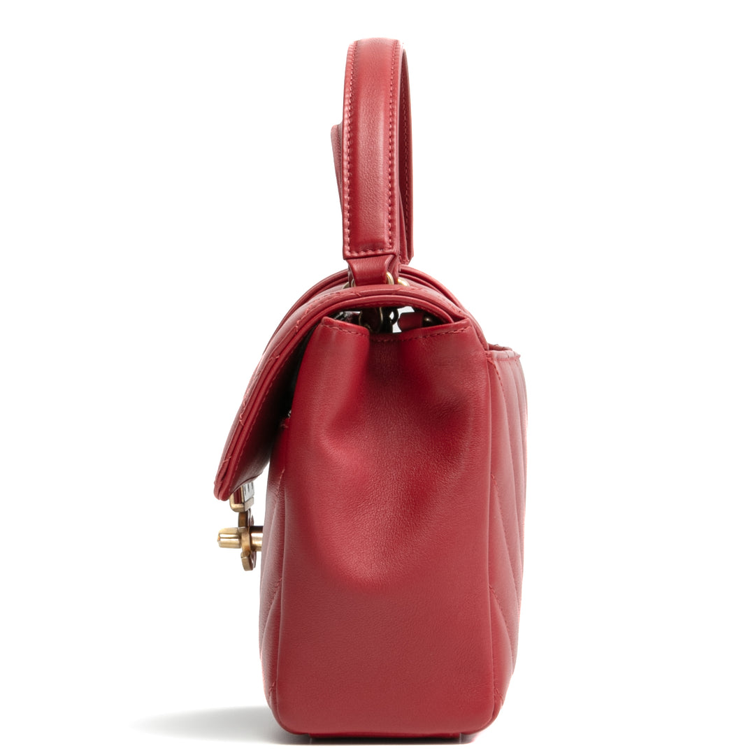 Bolsa de colgajo de mango superior de Chanel en la ciudad - rojo