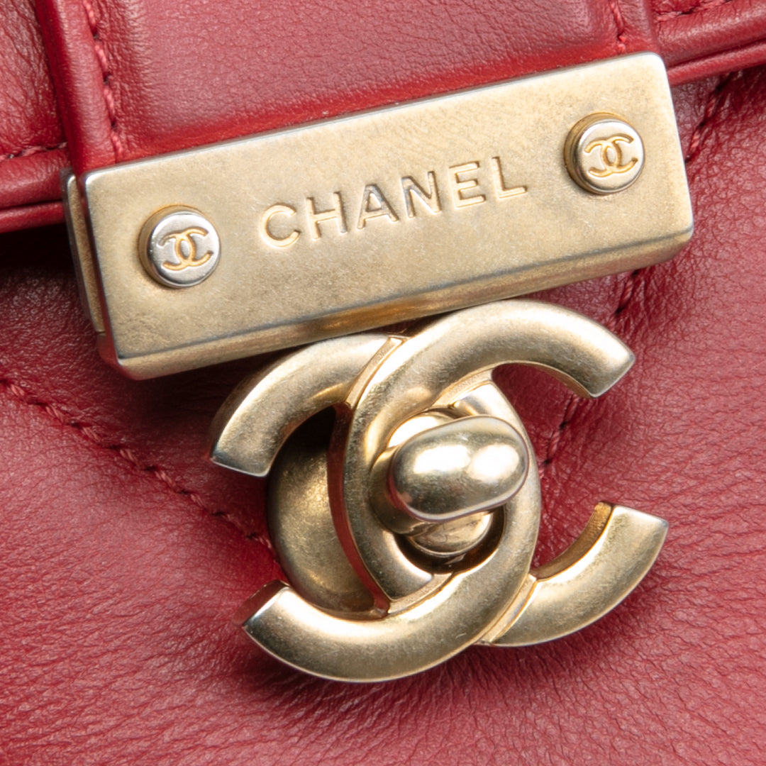 Bolsa de colgajo de mango superior de Chanel en la ciudad - rojo