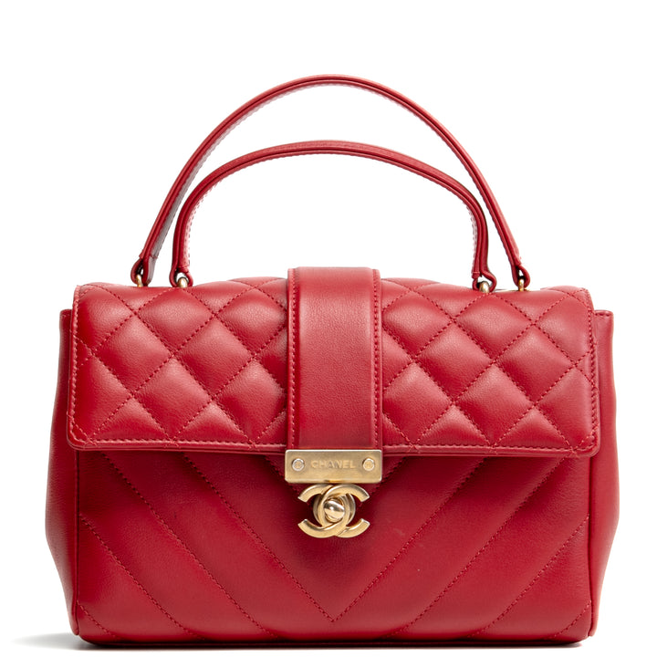 Bolsa de colgajo de mango superior de Chanel en la ciudad - rojo